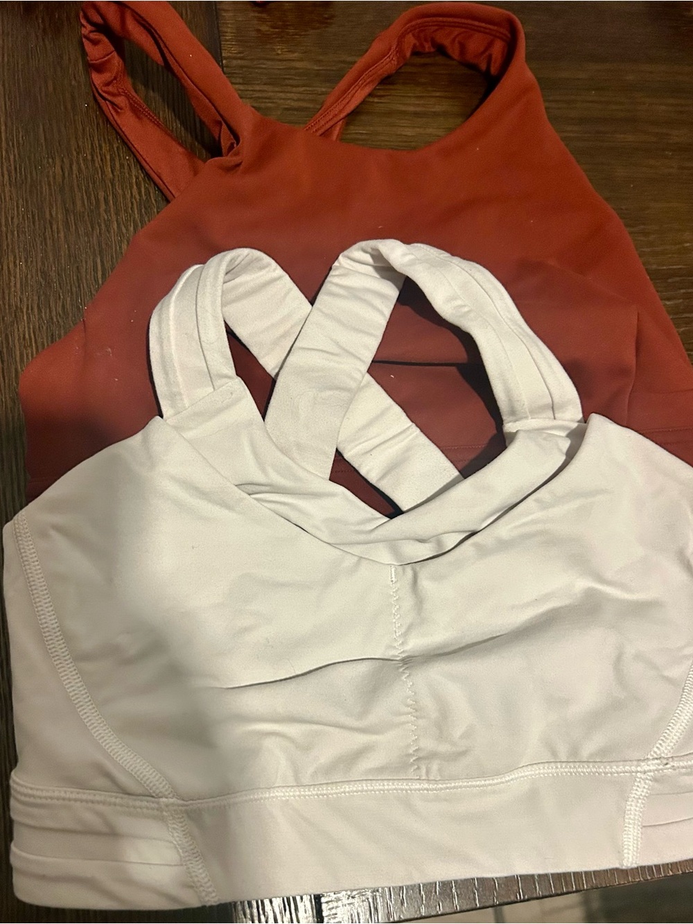 Two lululemon bras rust and white size 4